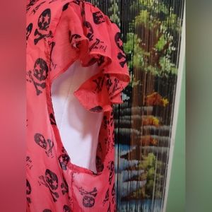 Orange skull and crossbones blouse. Size med/large